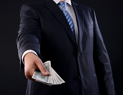 Businessman giving money