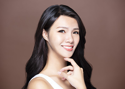 smiling young woman with natural makeup and long hair