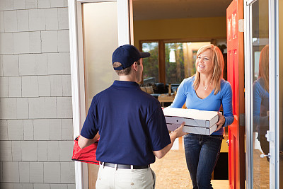 Pizza Delivery Man with Take-out Package at Customer's Door Hz