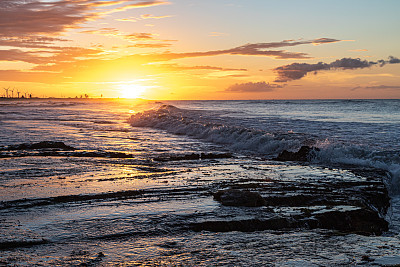Scenic sunset over the sea. The sun sets on the water.
