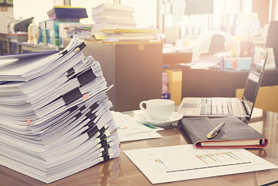 Business Concept, Pile of unfinished documents on office desk, Stack of business paper, Vintage Effect