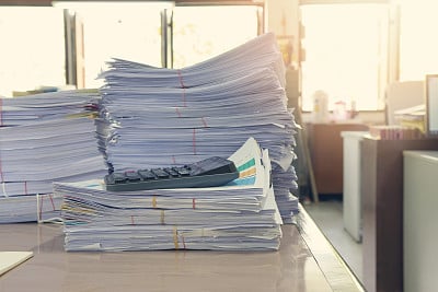 Business Concept, Pile of unfinished documents on office desk, Stack of business paper, Vintage Effect