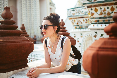 Young tourist woman in famous Bangkok Wat Pho temple