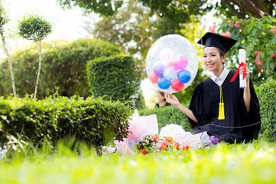 Happy graduated student girl - congratulations of education success.
