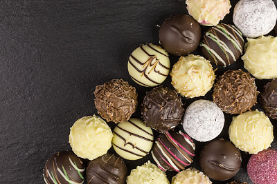 mixed chocolate truffles background