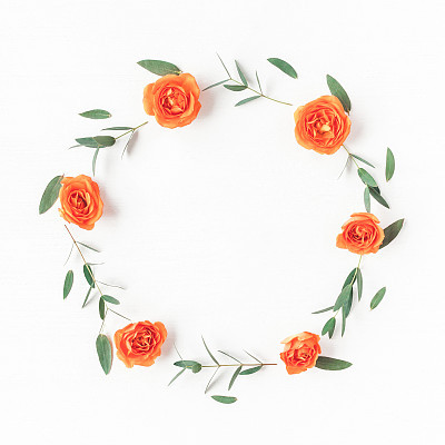 Wreath made of orange rose flowers and eucalyptus leaves