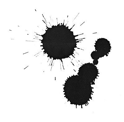 Black ink splatter drops close-up, isolated on white
