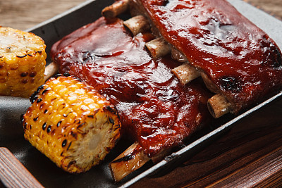 Hot grilled pork with spices and corn. Junk food.