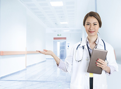 Female Asian Doctor is listening heart beat