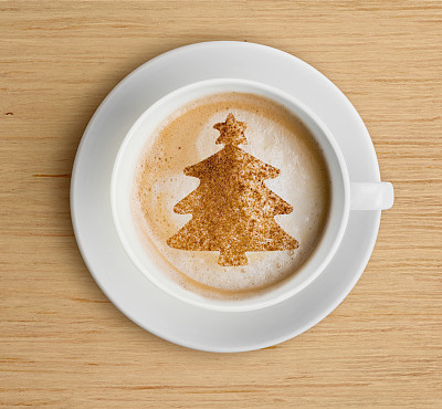 coffee cup with foam and christmas tree shape