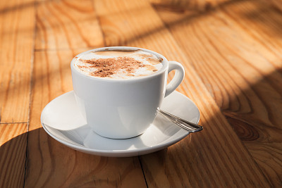 Cup of coffee with milk foam
