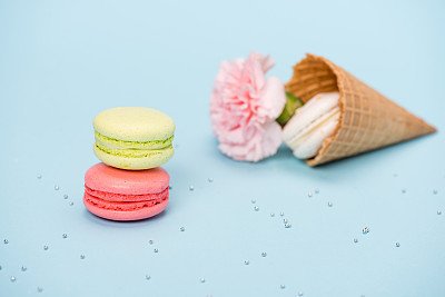 handmade macarons in waffle cone and pink flower