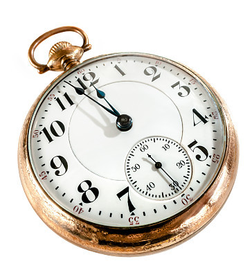 Old pocket watch missing its chain isolated on white
