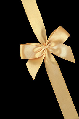 Golden bow isolated on black