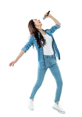 Cheerful woman singing on white background