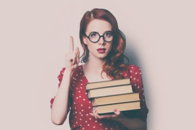 woman with pile of books