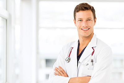 Smiling Young Doctor In Hospital