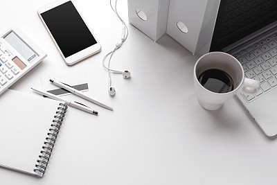 Business Items dropped in creative Disorder on white Table