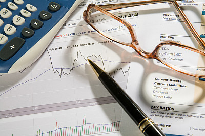 Pen over business or stock report
