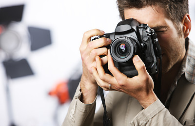 A photographer focusing on his target
