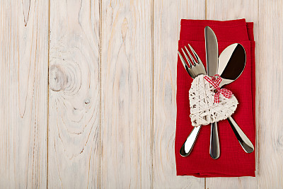 Valentine's day concept. On the wooden table cutlery