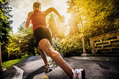 Rear view of Female Jogger in a park