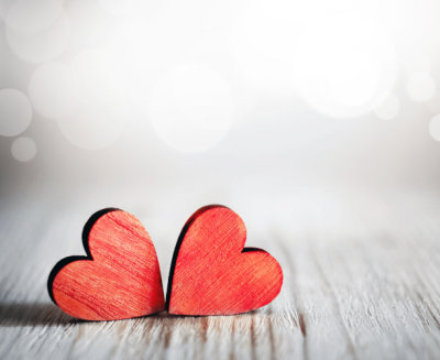 Valentines day. Red hearts on wooden background