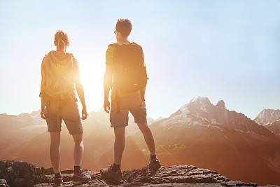 people traveling, hiking in mountains, couple of hikers