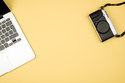 High angle view of office colored desk with copy space. Table with laptop and supplies. Top view. Flat lay. Freelancer or student desk