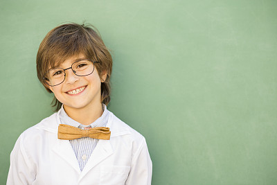 Education, children.  Happy boy in elementary classroom.