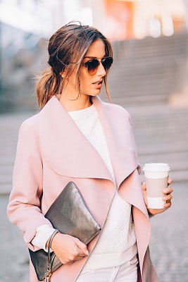 Beautiful elegant woman drinking coffee