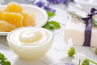 Body care products on white wood, top view