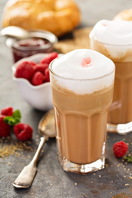 Hot coffee latte with raspberry syrup