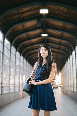 Portrait of woman wearing dress.