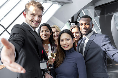 Group of business people having fun while taking selfie in a lobby