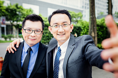 Business persons taking selfie