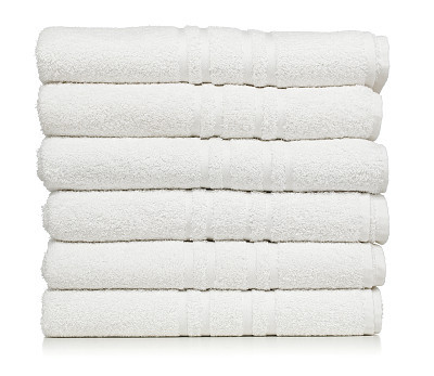 Stacks of white towels isolated on a white background