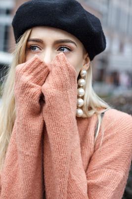 Beautiful woman in a pink sweater