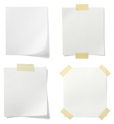 Four blank white pages taped to background