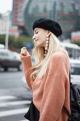 Beautiful woman in a pink sweater
