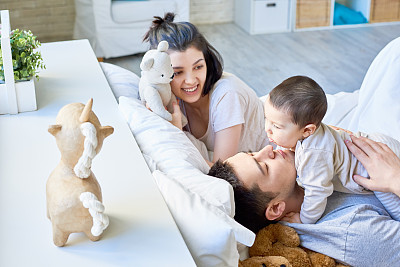 Happy Asian family with baby