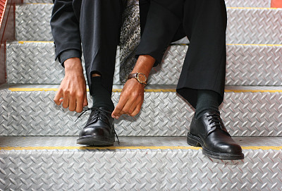 Businessman Tying His Shoes