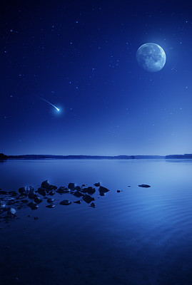 Rising moon over lake