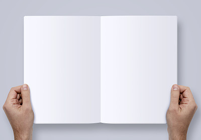 Hands Holding Magazine With Two Clipping Paths