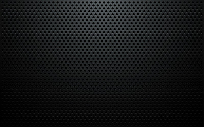 Perforated black metal sheet background