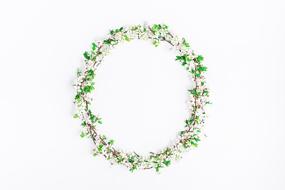 Frame made of apple tree flowers. Flat lay, top view