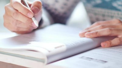 man student reading book
