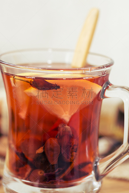 Healthy herbal tea,  spiced tea over wood background