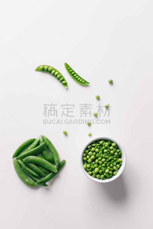 Healthy raw green peas on white background