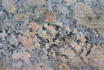 texture de faux marbre gris orangé. matériaux composite rugueux. macro
